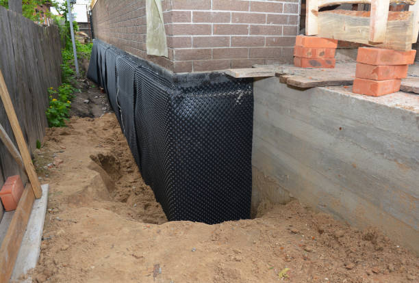 Happy homeowners after waterproofing job in Ashippun